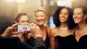 Event photography / Phone, photography or women in a party in celebration of goals or new year at fancy luxury event. | Guests capturing moments at an event using Nalu Moments photo sharing platform